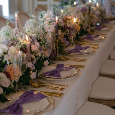 Luxury Bridgerton Wedding With Purple Velvet Napkin Bows at Avington Park