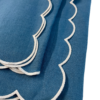 Blue linen napkin with white scallop edge